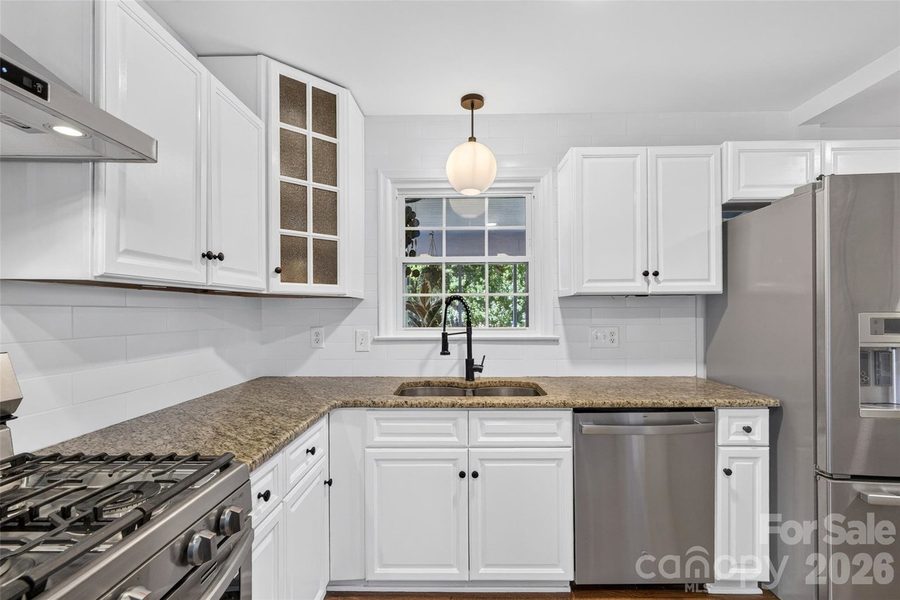 Kitchen with granite countertops and stainless appliances